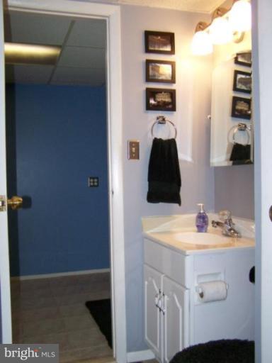 4005 Rustico Road Middle River, MD 21220 - Photo 16 of 20 a bathroom with a sink and a mirror