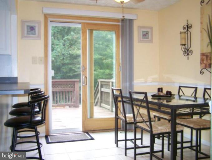 4005 Rustico Road Middle River, MD 21220 - Photo 7 of 20 a view of a dining room with furniture and a window