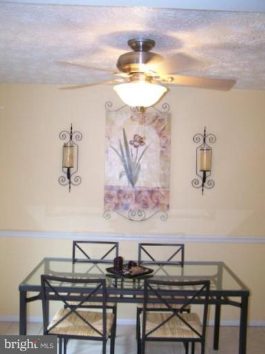 4005 Rustico Road Middle River, MD 21220 - Photo 8 of 20 a view of a dining room with furniture and a chandelier