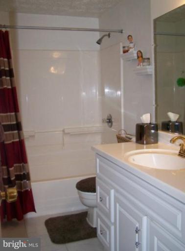 4005 Rustico Road Middle River, MD 21220 - Photo 9 of 20 a bathroom with a sink a toilet and shower