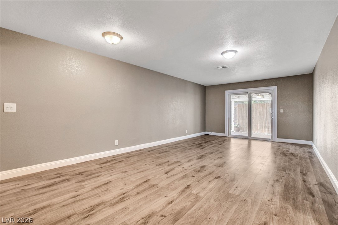 4367 South Mojave Road Las Vegas, NV 89121 - Photo 53 of 53 An open floorplan with durable flooring and backyard access through sliding glass doors.