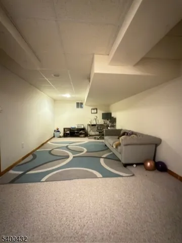 a living room with a couch and a stove