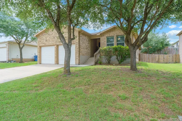 a house with huge green field in front of it