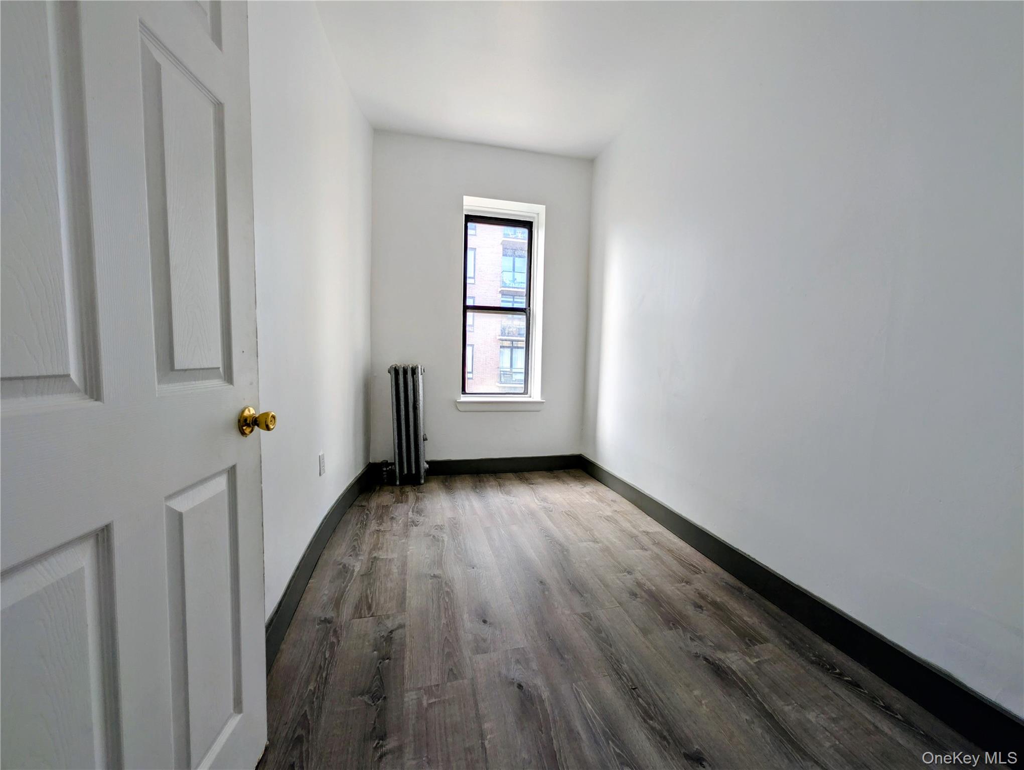 149 South 4th Street, Unit 25 Brooklyn, NY 11211 - Photo 6 of 12 a view of a room with wooden floor and window