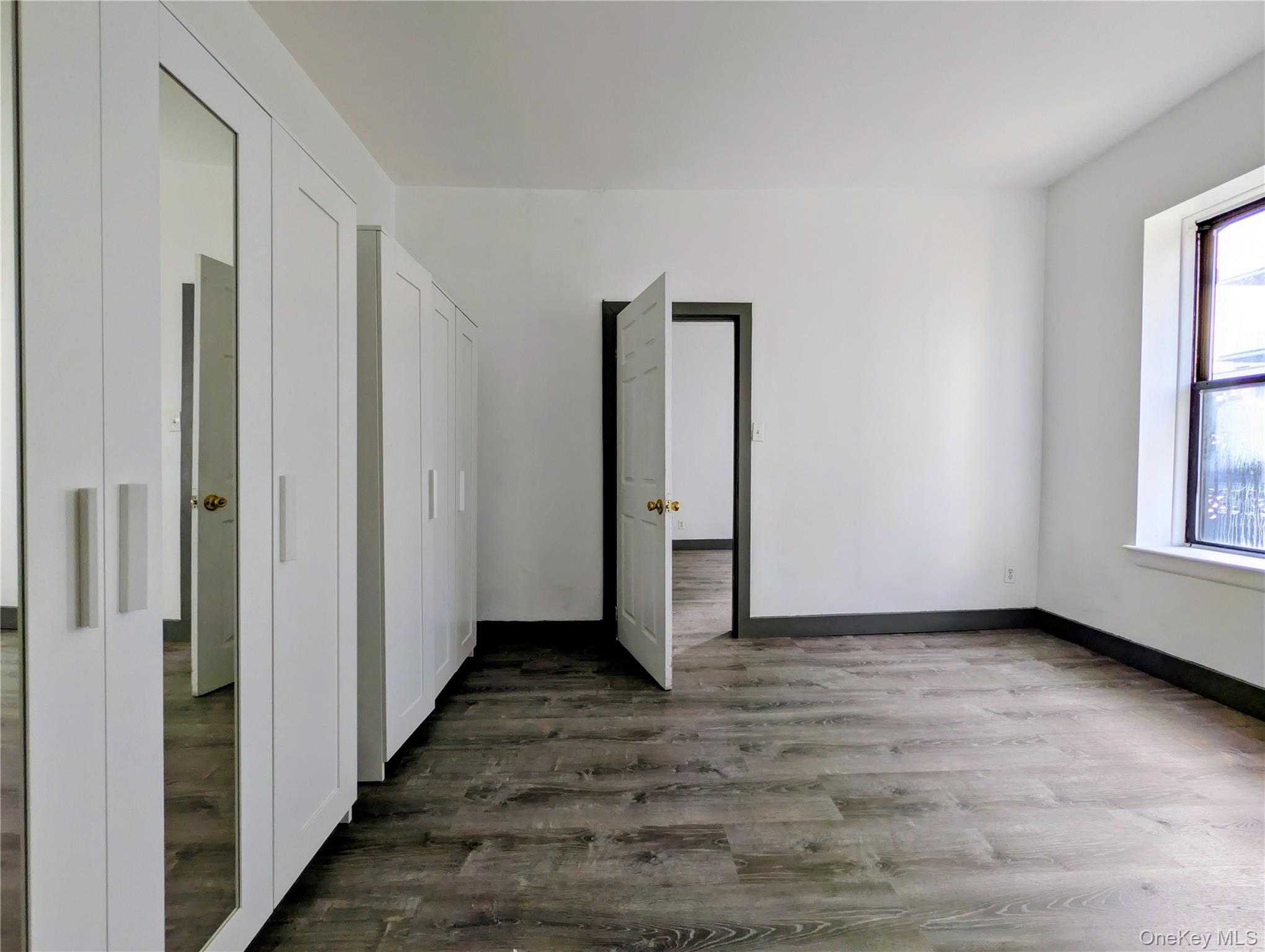 149 South 4th Street, Unit 25 Brooklyn, NY 11211 - Photo 8 of 12 a view of hallway with window and wooden floor