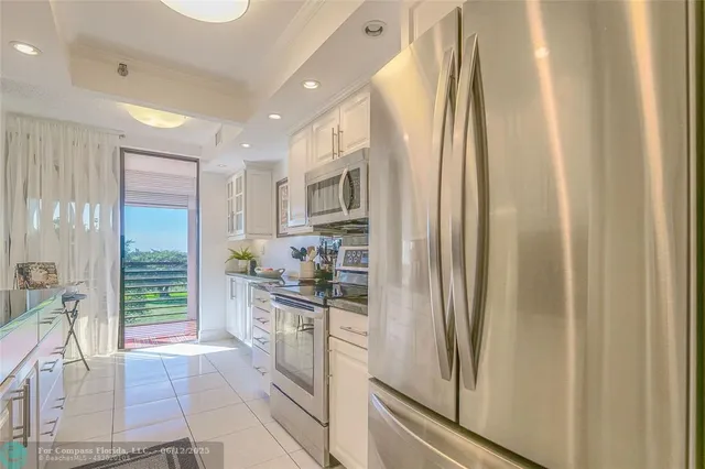 a kitchen with stainless steel appliances a refrigerator stove and sink