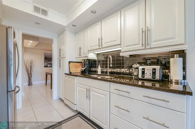 a large bedroom with a bed and a couch