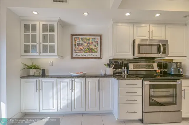 a close view of a utility room with dryer and washer