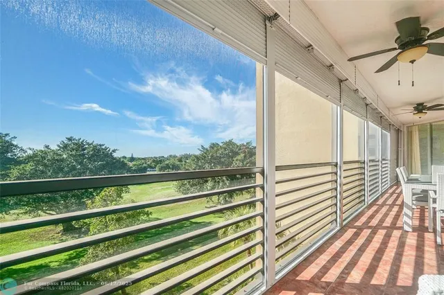 a view of outdoor space with wooden floor
