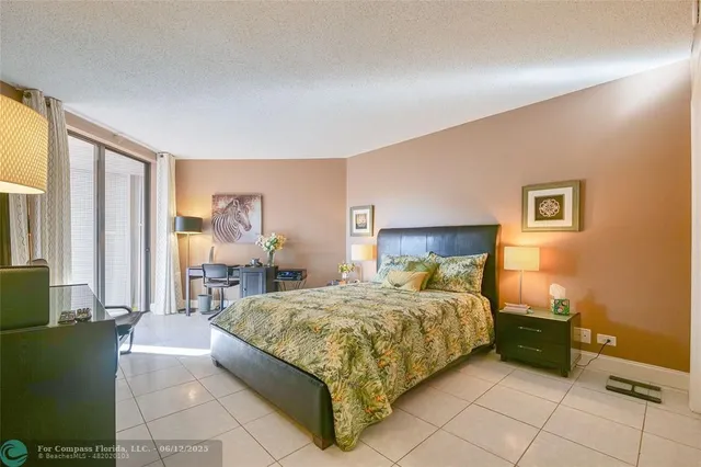 a spacious bedroom with a bed and a dresser