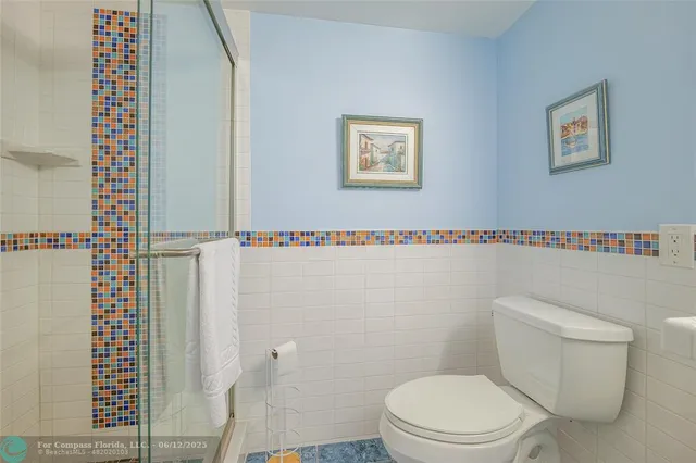 an aerial view of multiple houses with yard