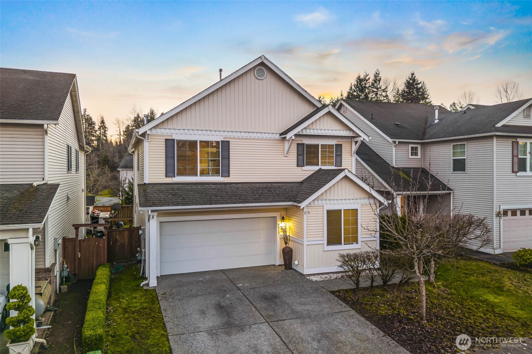 2513 Northeast 2nd Street Renton, WA 98056 - Photo 1 of 38 a front view of a house with a yard and garage