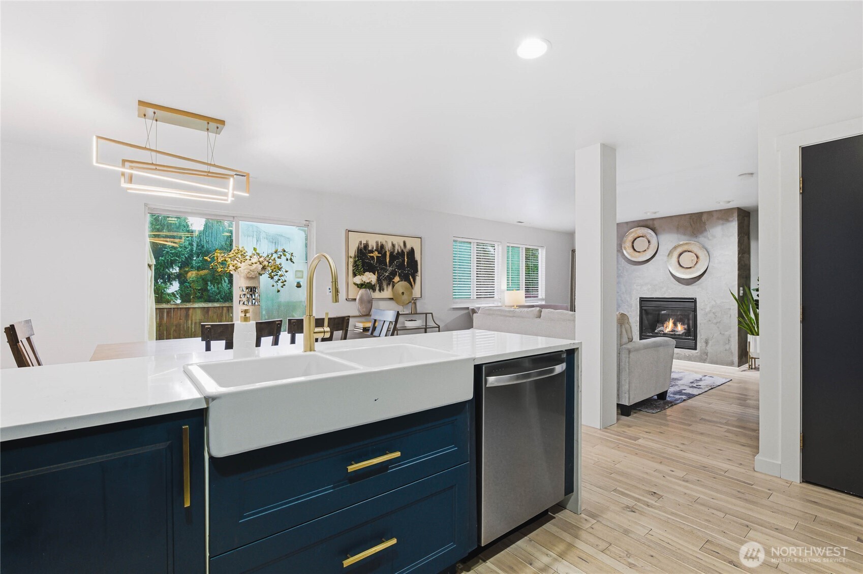 2513 Northeast 2nd Street Renton, WA 98056 - Photo 13 of 38 a kitchen with a sink cabinets and wooden floor