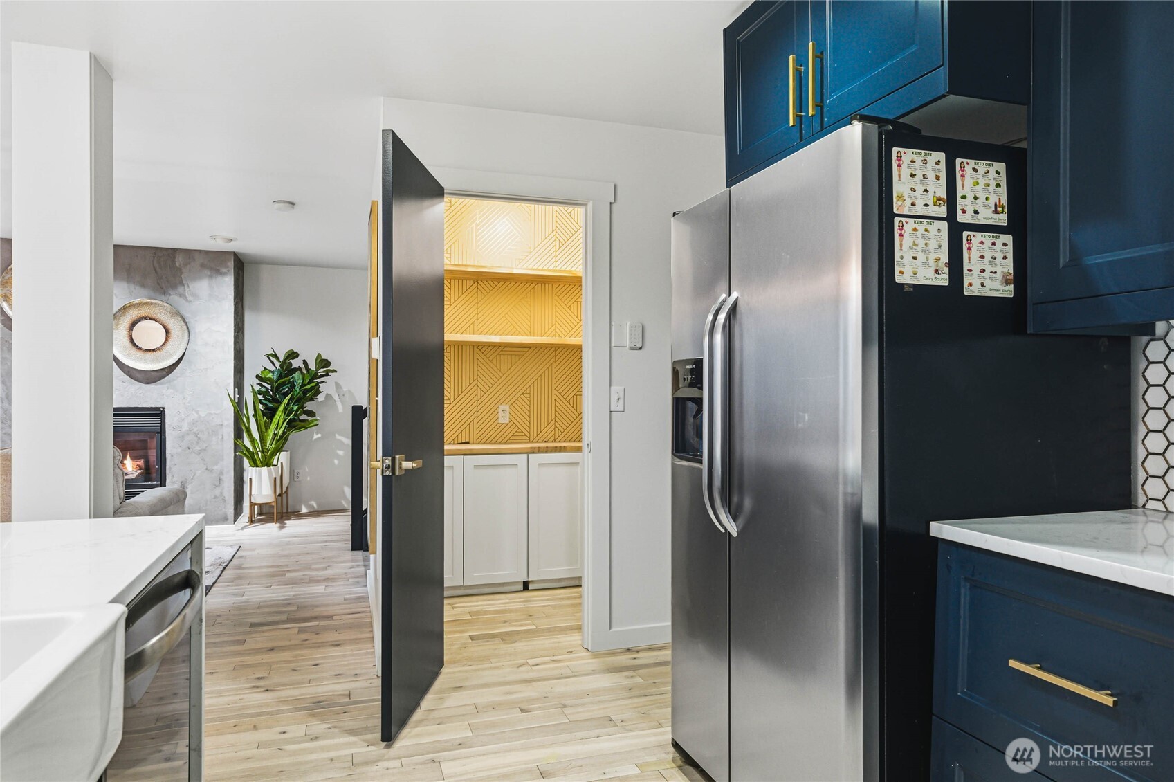 2513 Northeast 2nd Street Renton, WA 98056 - Photo 14 of 38 a kitchen with stainless steel appliances granite countertop a refrigerator a oven and a sink with wooden floor