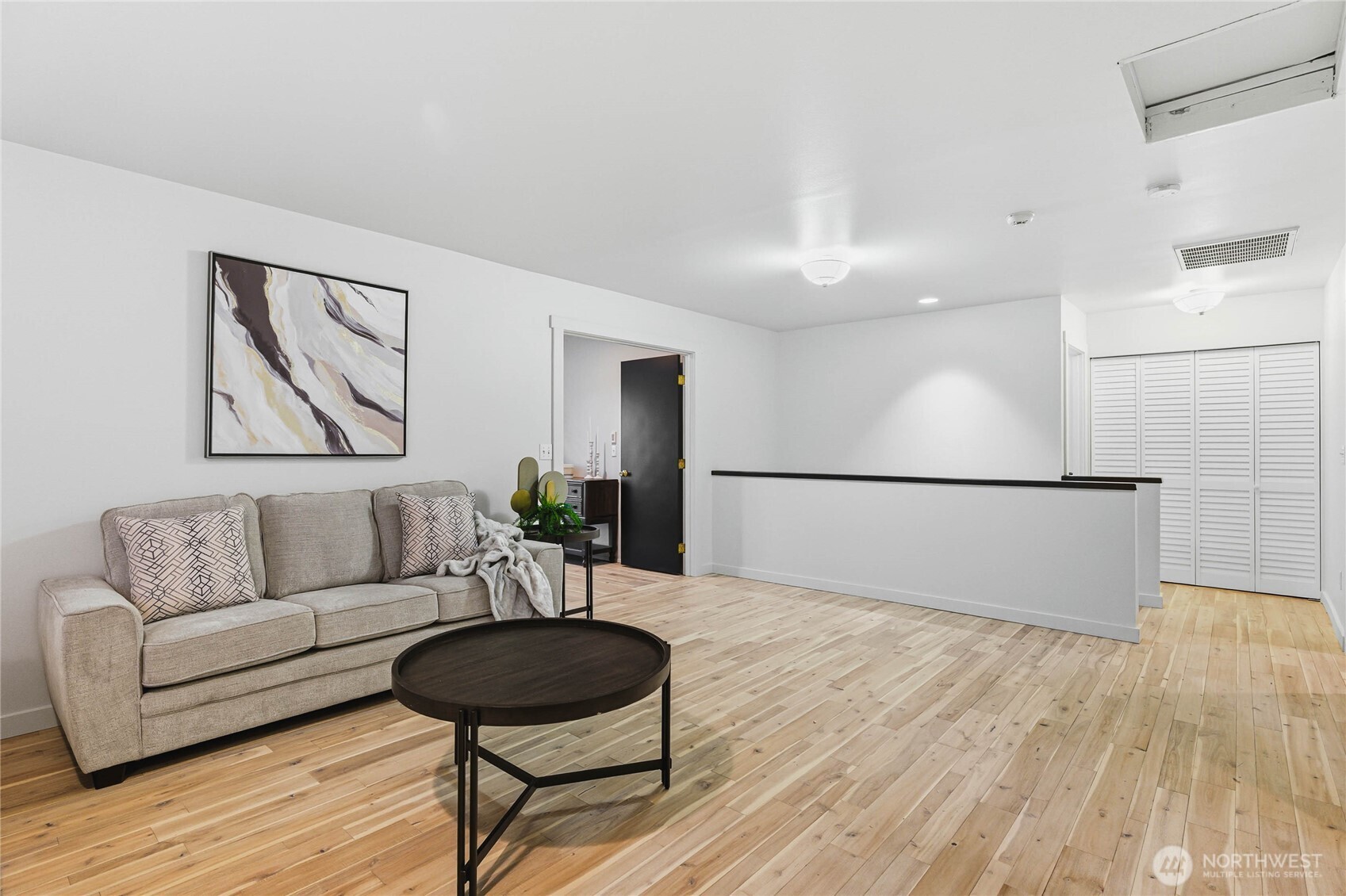 2513 Northeast 2nd Street Renton, WA 98056 - Photo 16 of 38 a living room with furniture and a wooden floor