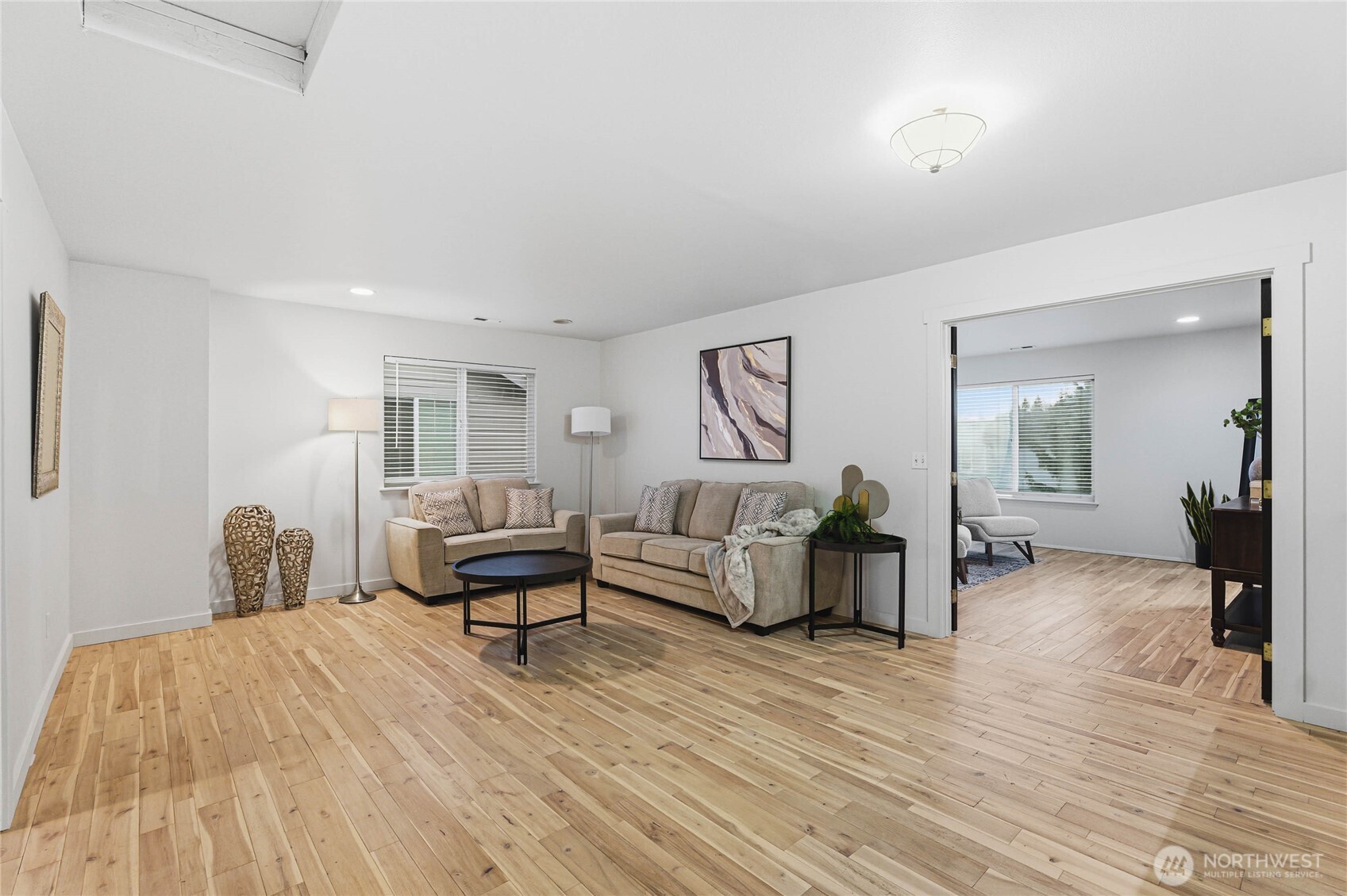 2513 Northeast 2nd Street Renton, WA 98056 - Photo 18 of 38 a living room with furniture and a wooden floor
