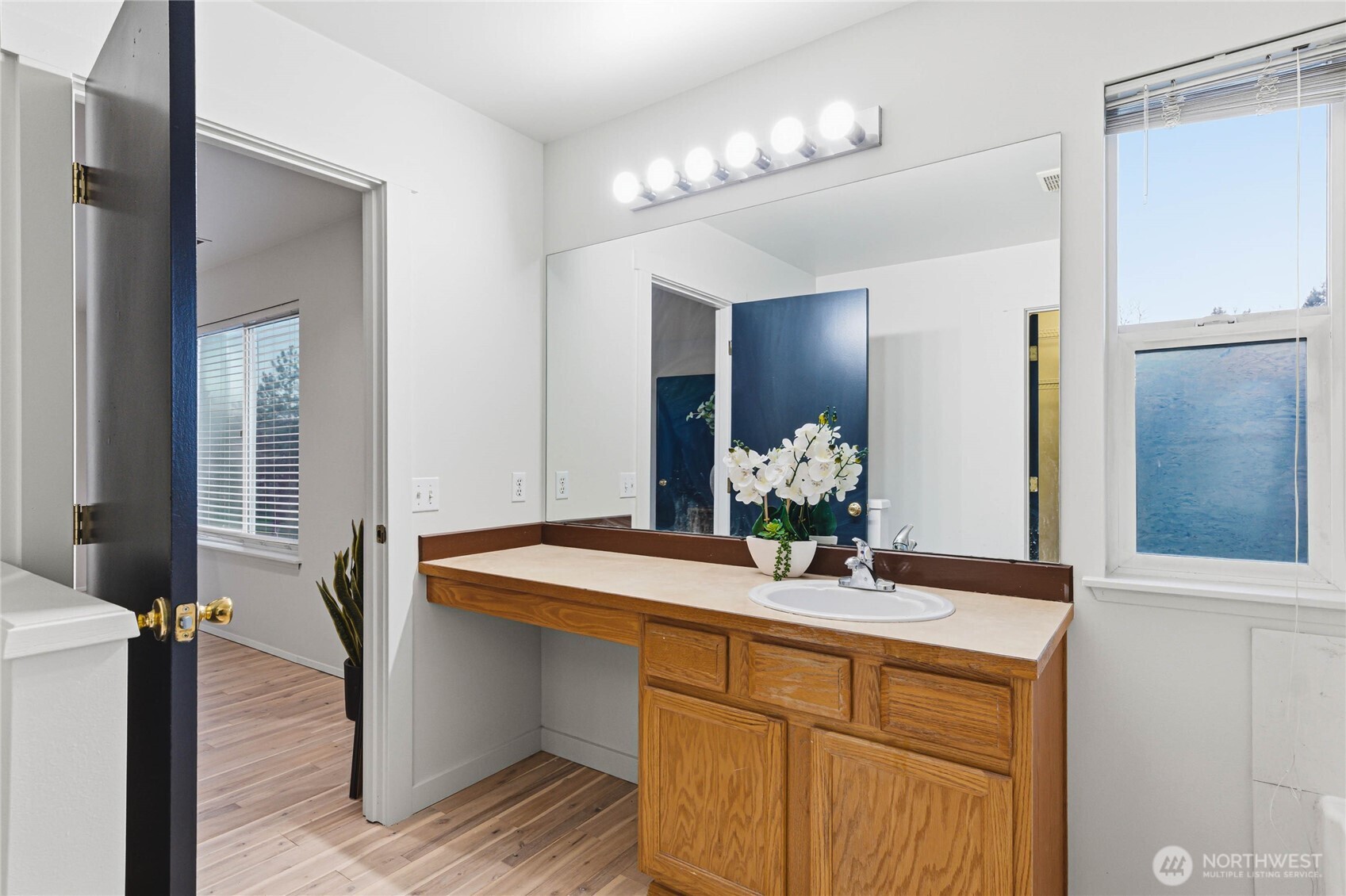 2513 Northeast 2nd Street Renton, WA 98056 - Photo 22 of 38 a bathroom with a sink and a mirror