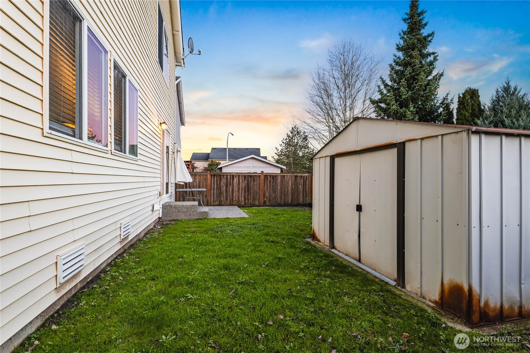 2513 Northeast 2nd Street Renton, WA 98056 - Photo 35 of 38 a view of a house with backyard and trees