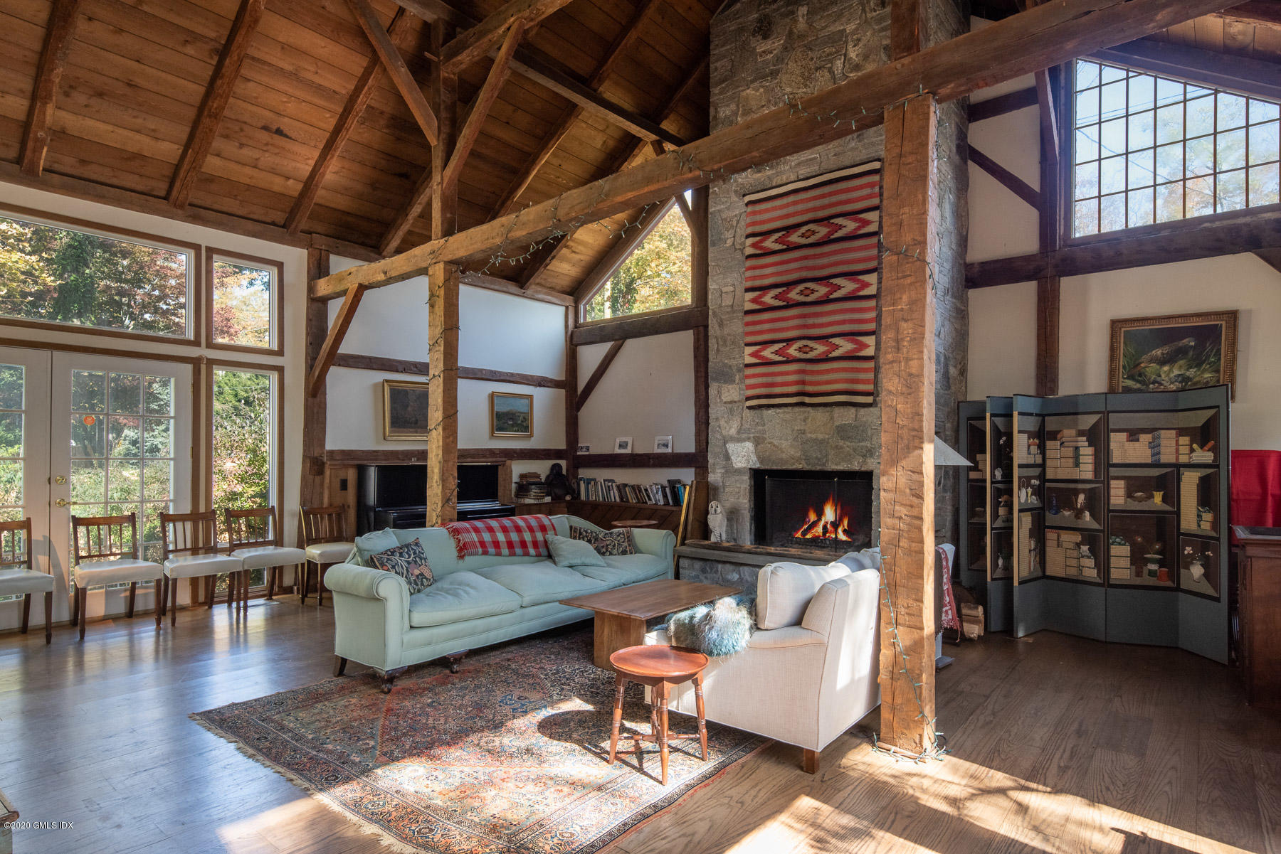 262 Stanwich Road Greenwich, CT 06830 - Photo 5 of 32 a living room with furniture a fireplace and a table