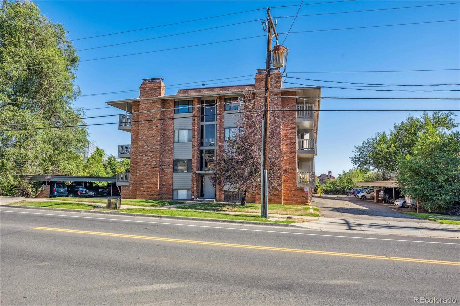 2141 Baseline Road, Unit 4 Boulder, CO 80302 - Photo 2 of 22 a view of a brick building next to a road