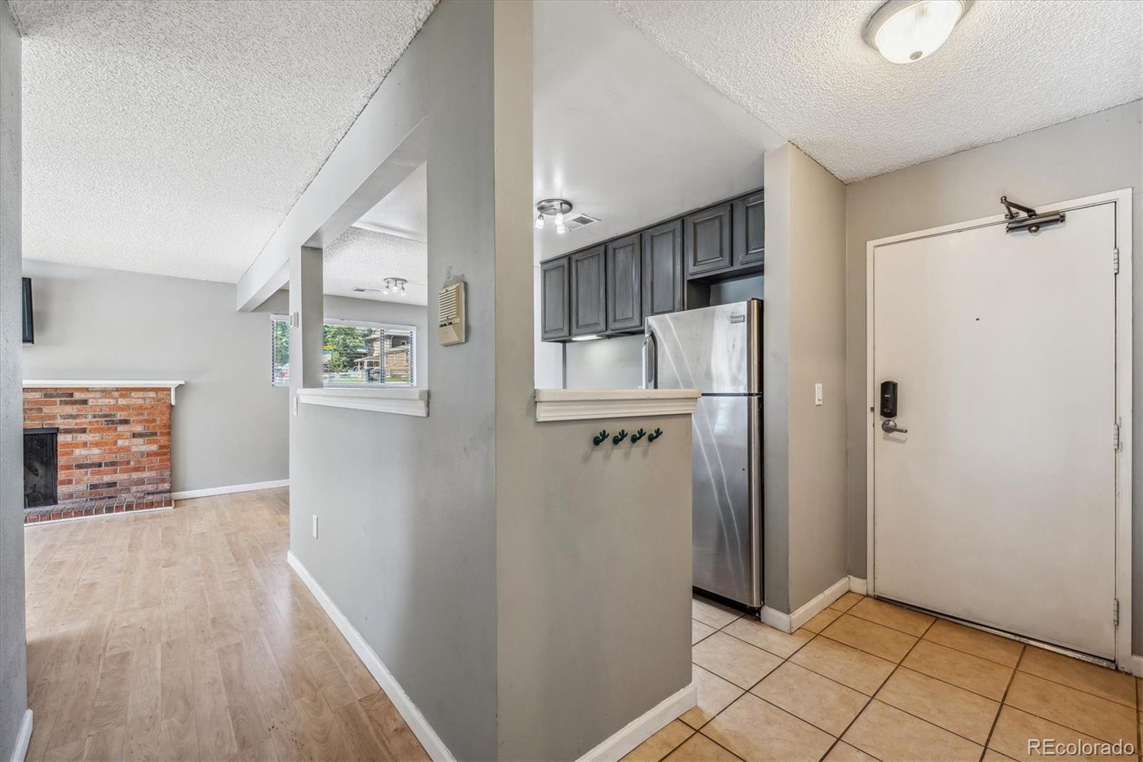 2141 Baseline Road, Unit 4 Boulder, CO 80302 - Photo 7 of 22 a view of a hallway with wooden floor and closet