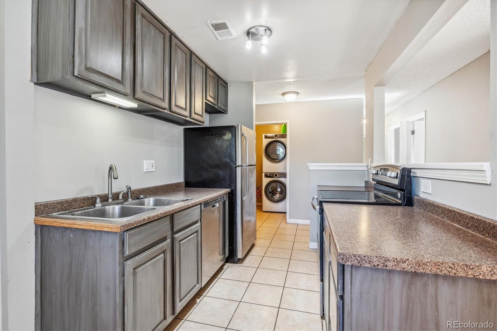 2141 Baseline Road, Unit 4 Boulder, CO 80302 - Photo 8 of 22 a kitchen with a sink a stove top oven a refrigerator and a cabinets