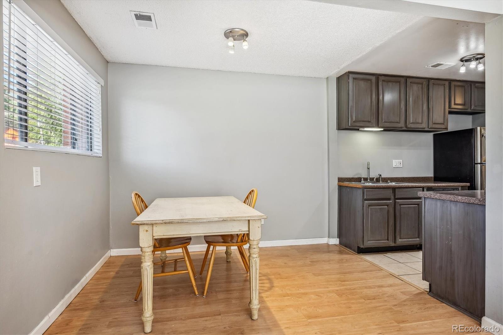 2141 Baseline Road, Unit 4 Boulder, CO 80302 - Photo 10 of 22 a kitchen with stainless steel appliances granite countertop a stove top oven a sink counter space and dining table