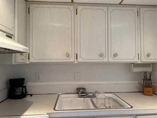 a view of a storage and utility room with washer and dryer