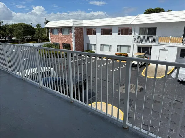 a front view of a house with a street