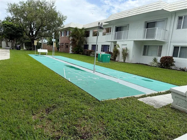 a view of house with outdoor space and garden