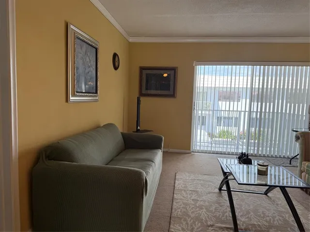 a living room with furniture and a window