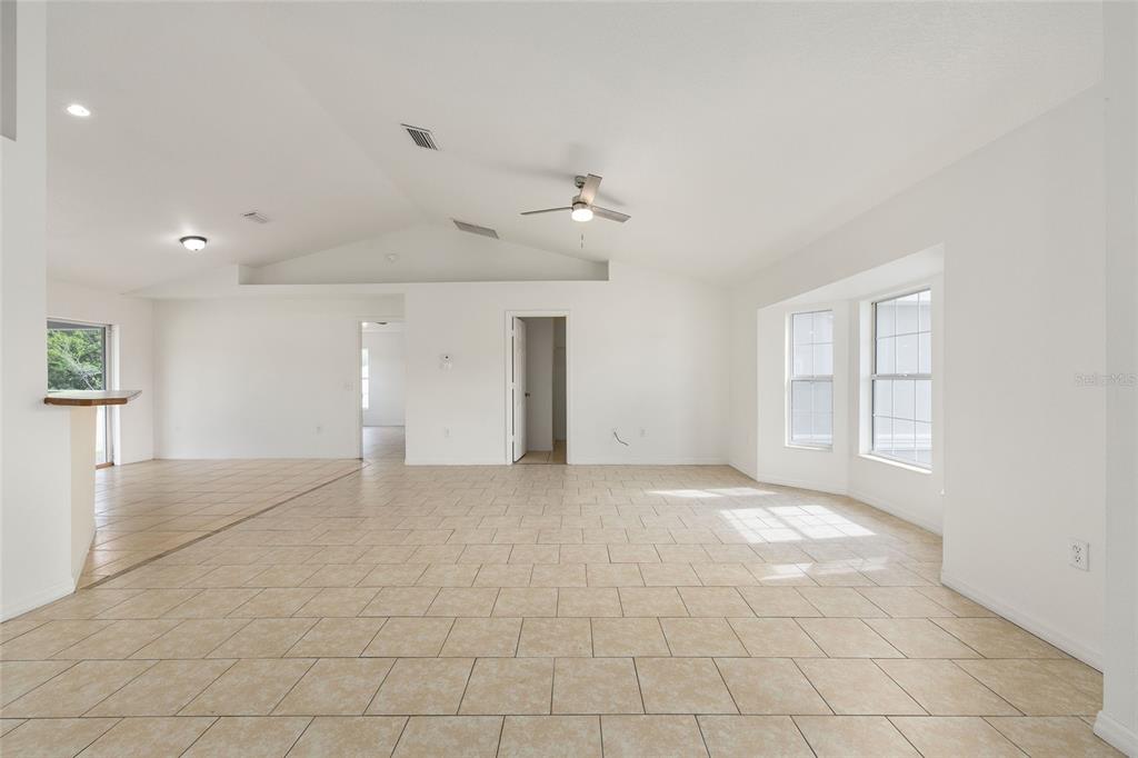 15434 Southwest 23rd Court Road Ocala, FL 34473 - Photo 7 of 41 an empty room with a empty space and windows