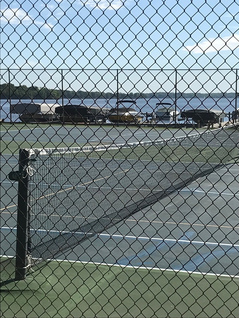 77 Mineola Road, Unit 77 Fox Lake, IL 60020 - Photo 15 of 24 a view of a wall and a wooden fence