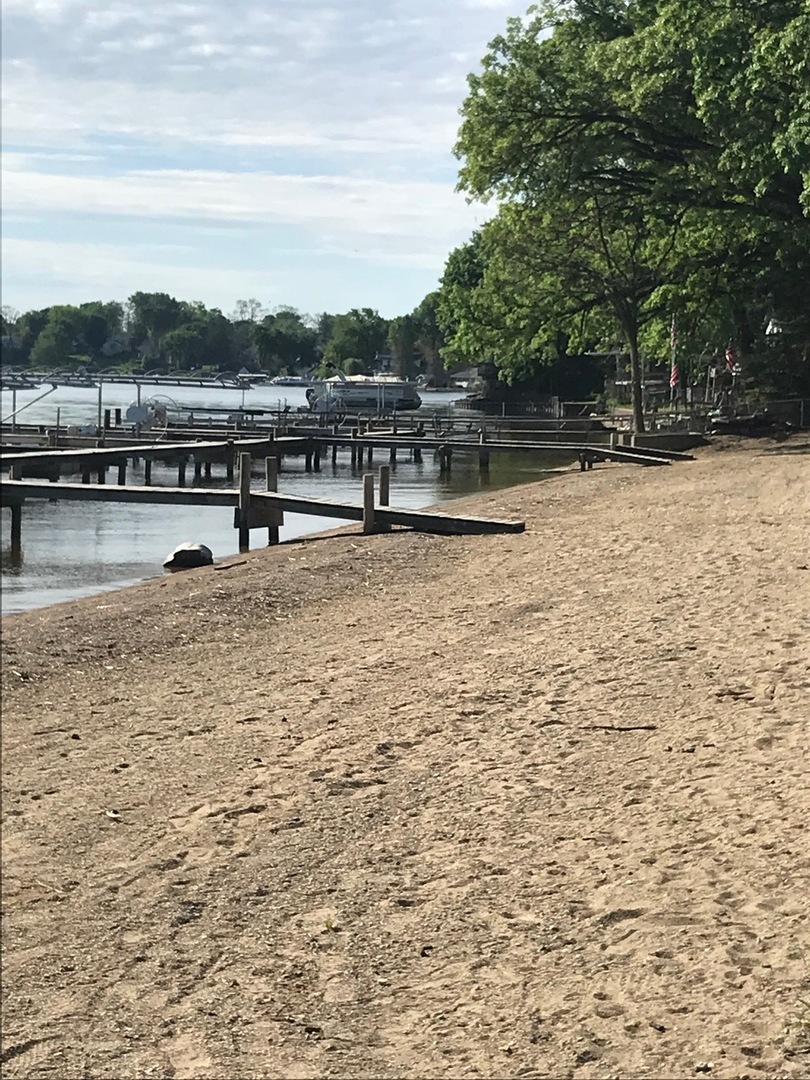 77 Mineola Road, Unit 77 Fox Lake, IL 60020 - Photo 21 of 24 a view of outdoor space with lake view