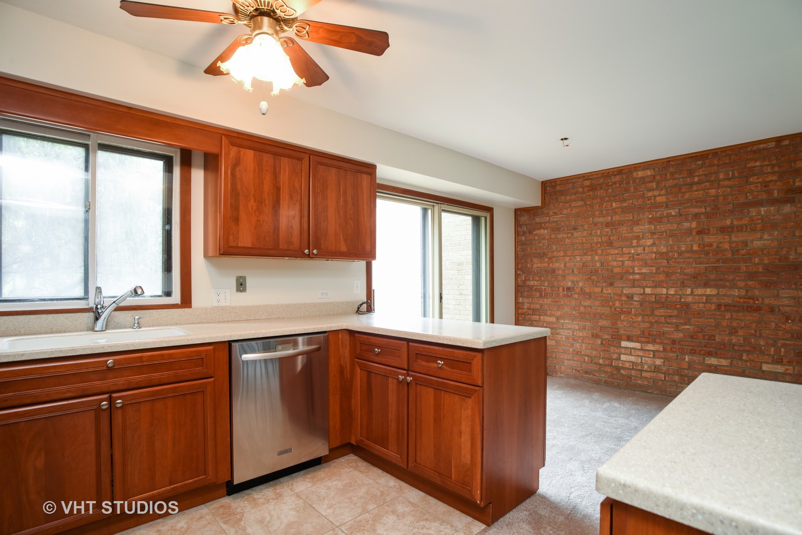 77 Mineola Road, Unit 77 Fox Lake, IL 60020 - Photo 7 of 24 a kitchen with a sink and cabinets