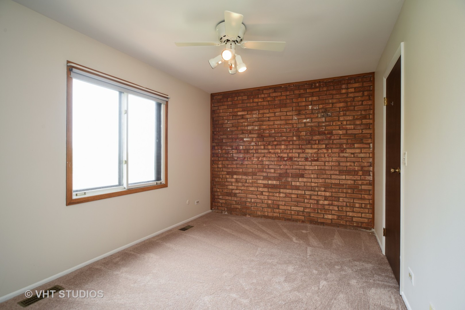 77 Mineola Road, Unit 77 Fox Lake, IL 60020 - Photo 10 of 24 a view of livingroom with window and a ceiling fan