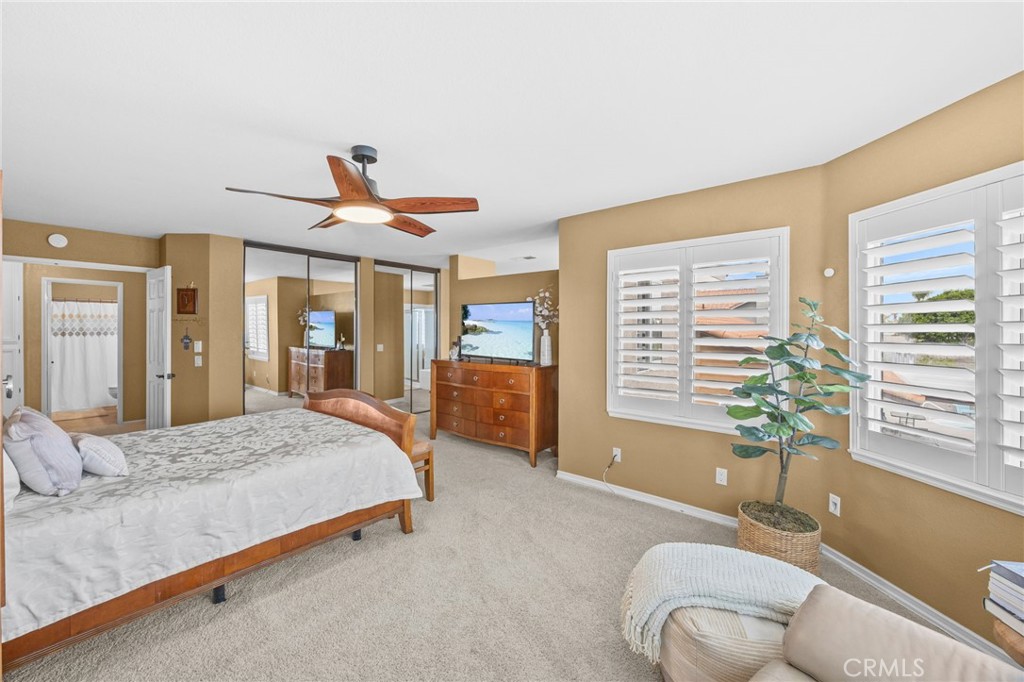 20257 Edmund Road Riverside, CA 92508 - Photo 29 of 53 a bedroom with a bed and ceiling fan