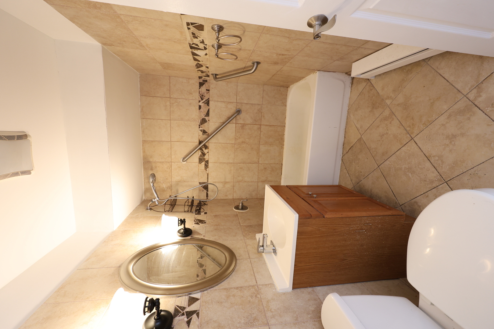 2230 South Goebbert Road, Unit 139 Arlington Heights, IL 60005 - Photo 11 of 14 a bathroom with a sink a toilet and a mirror