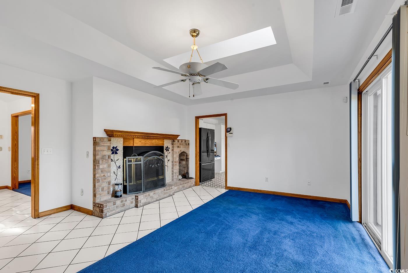 5938 Rahnavard Boulevard Myrtle Beach, SC 29588 - Photo 14 of 39 Unfurnished living room featuring a skylight, a br