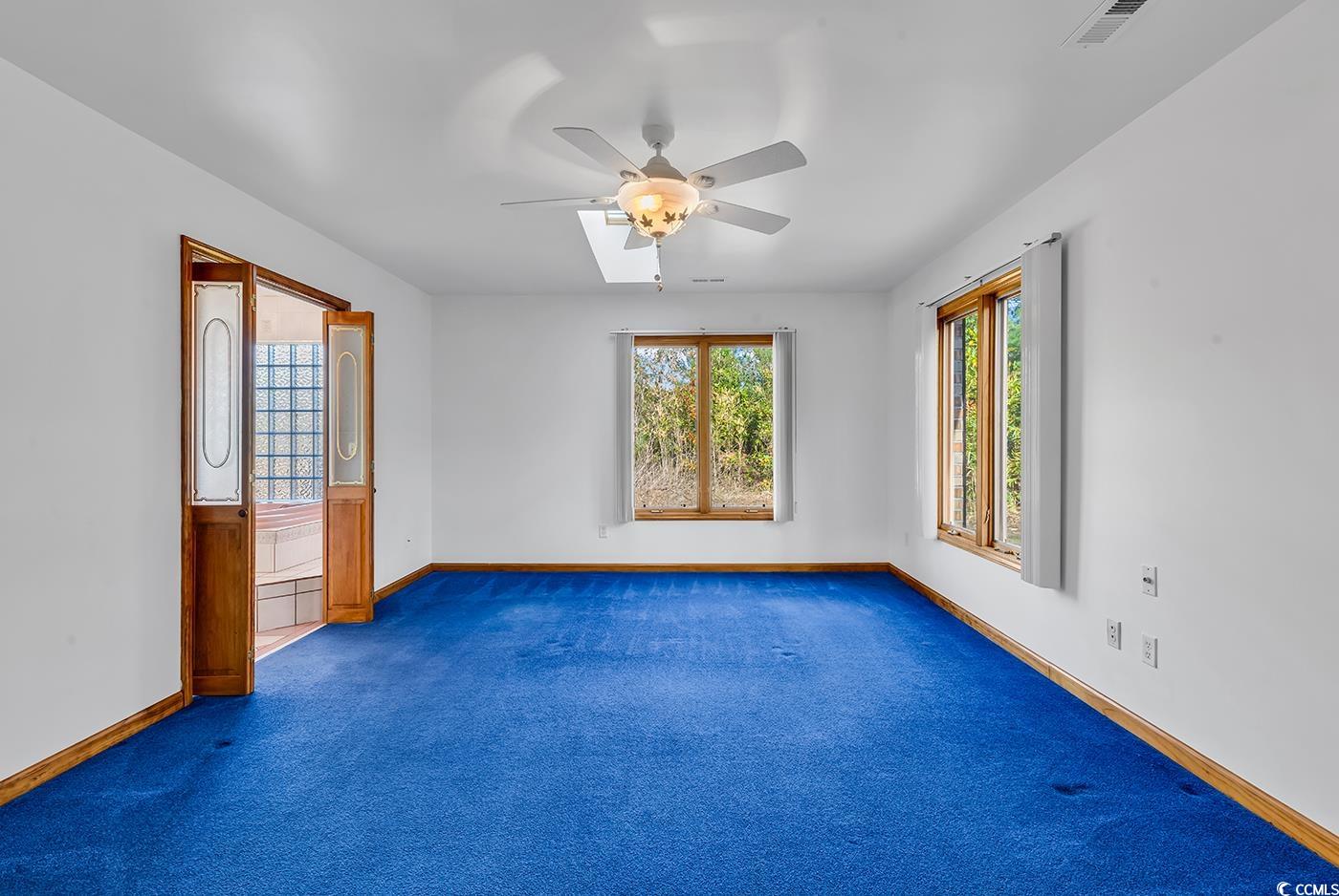 5938 Rahnavard Boulevard Myrtle Beach, SC 29588 - Photo 16 of 39 Carpeted spare room featuring ceiling fan
