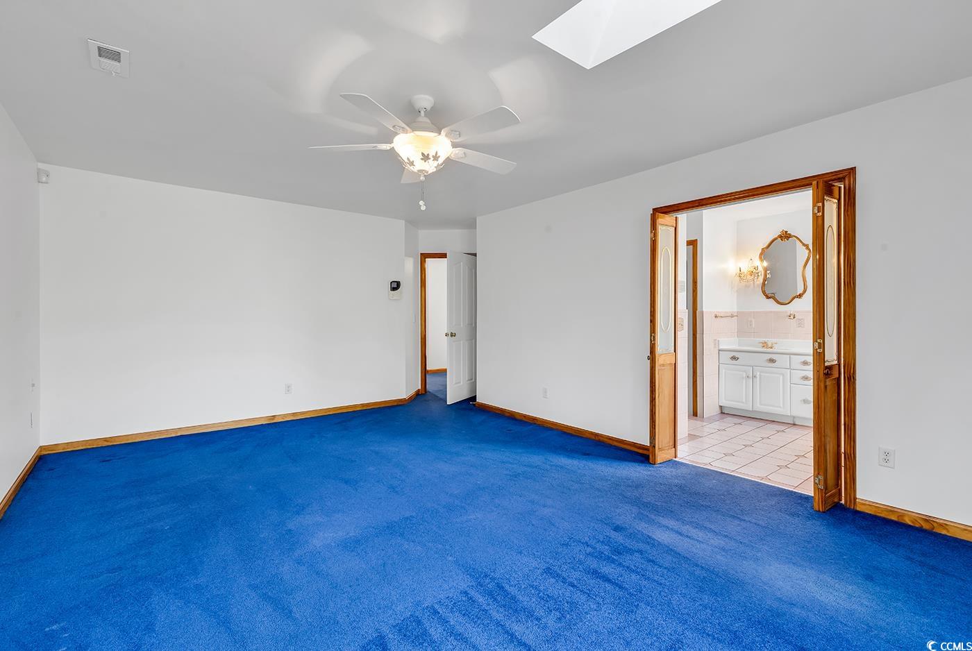 5938 Rahnavard Boulevard Myrtle Beach, SC 29588 - Photo 17 of 39 Unfurnished bedroom with ceiling fan, light carpet