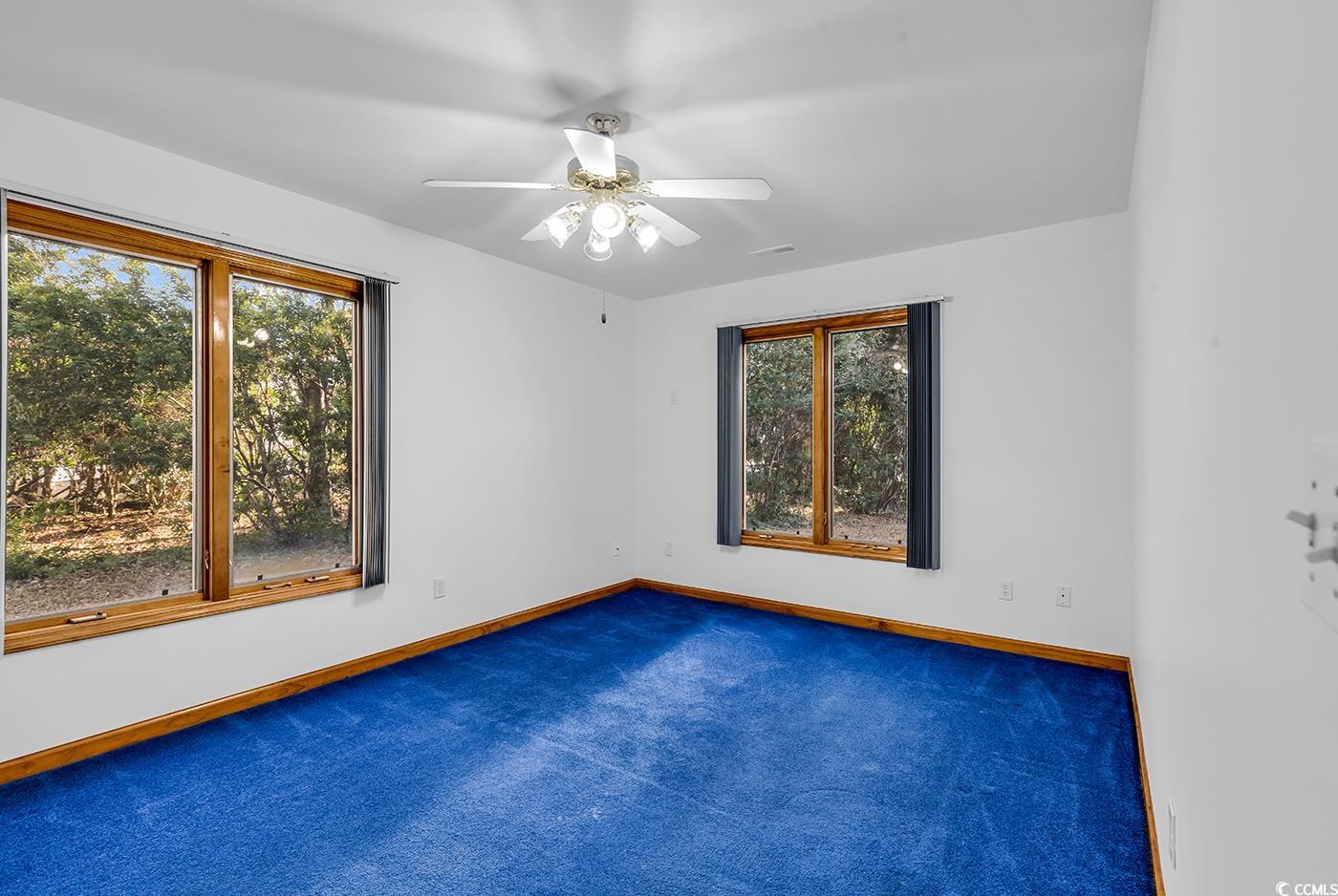 5938 Rahnavard Boulevard Myrtle Beach, SC 29588 - Photo 24 of 39 Unfurnished room with dark colored carpet and ceil