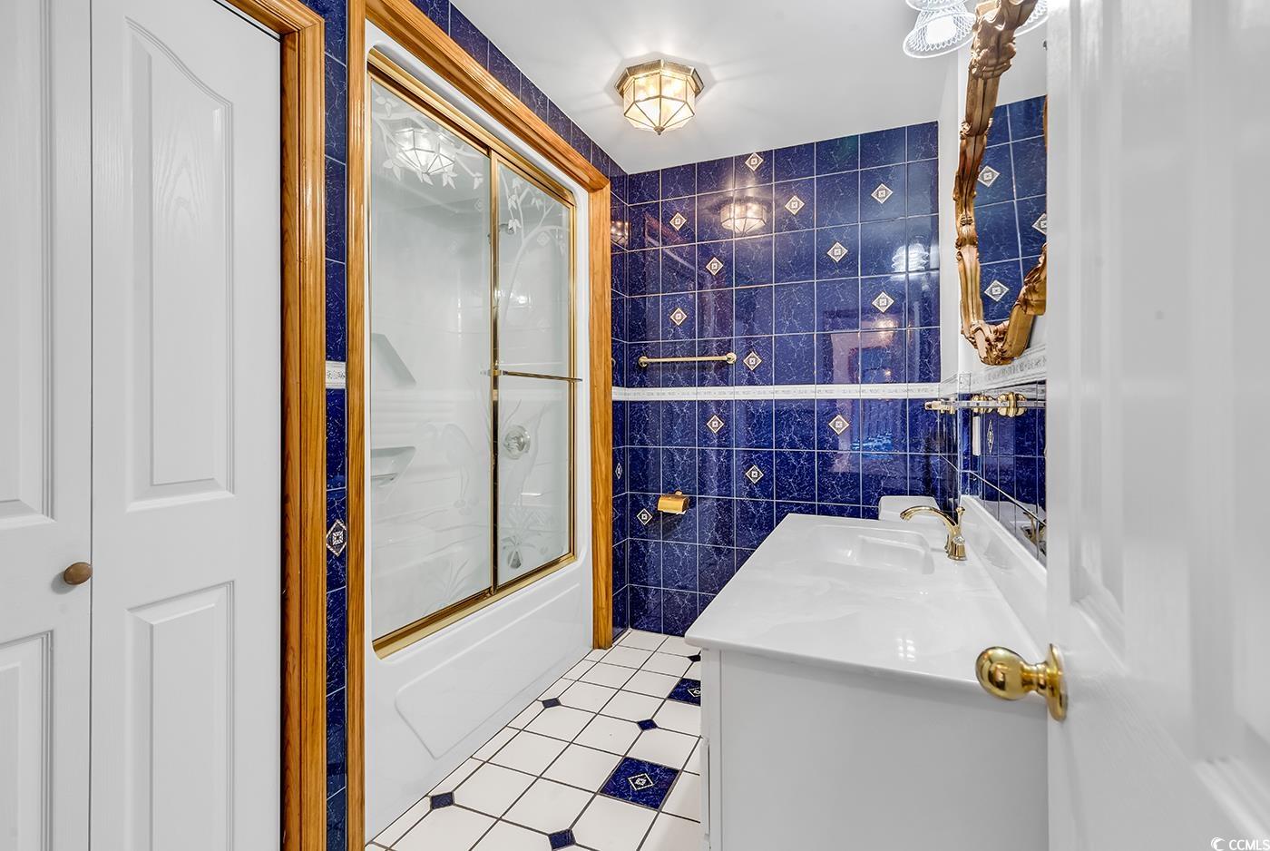 5938 Rahnavard Boulevard Myrtle Beach, SC 29588 - Photo 25 of 39 Bathroom featuring tile patterned flooring, vanity