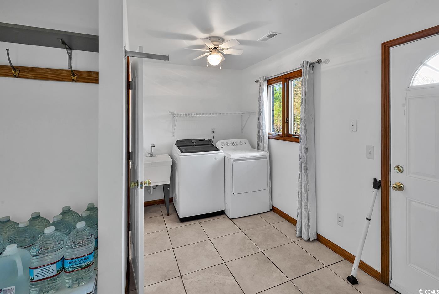 5938 Rahnavard Boulevard Myrtle Beach, SC 29588 - Photo 27 of 39 Laundry room with washer and dryer, a healthy amou