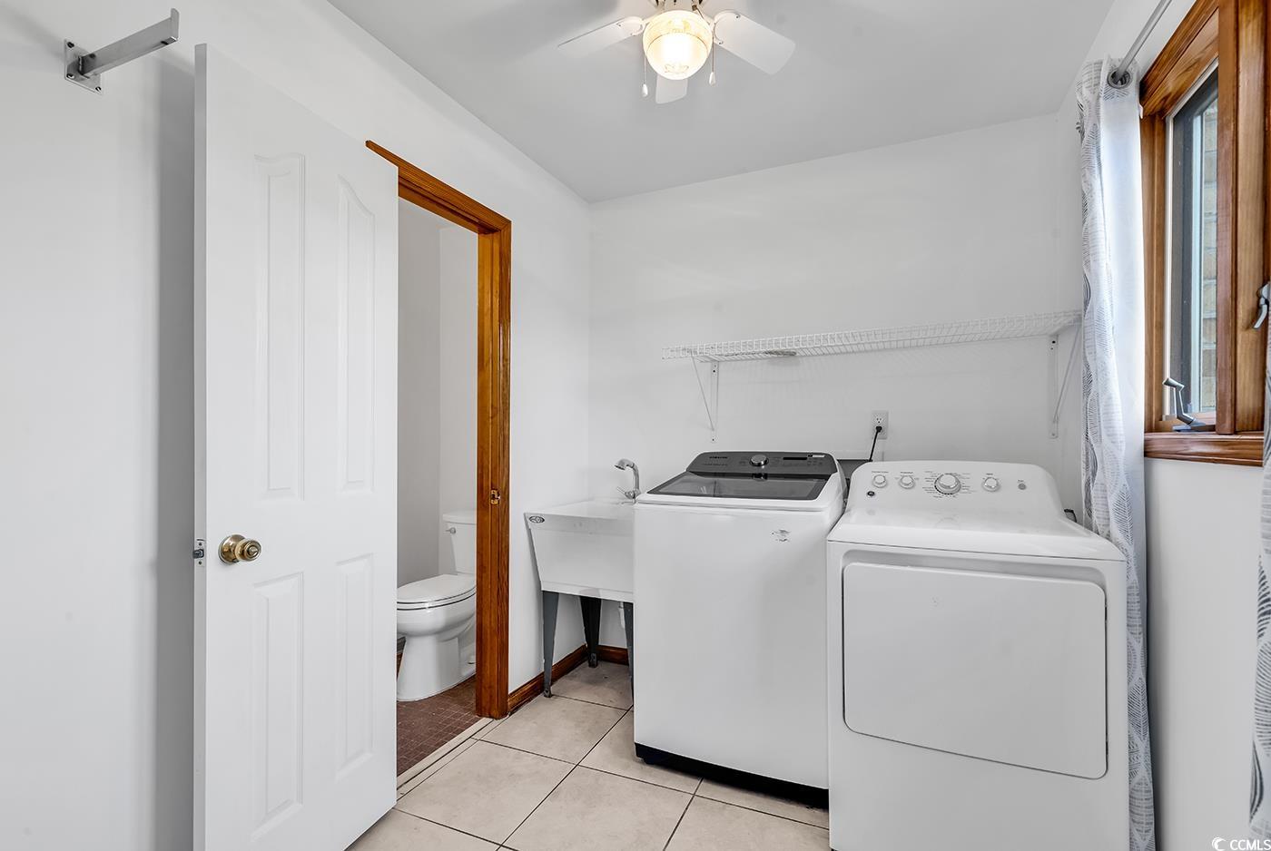 5938 Rahnavard Boulevard Myrtle Beach, SC 29588 - Photo 28 of 39 Laundry area with separate washer and dryer, ceili