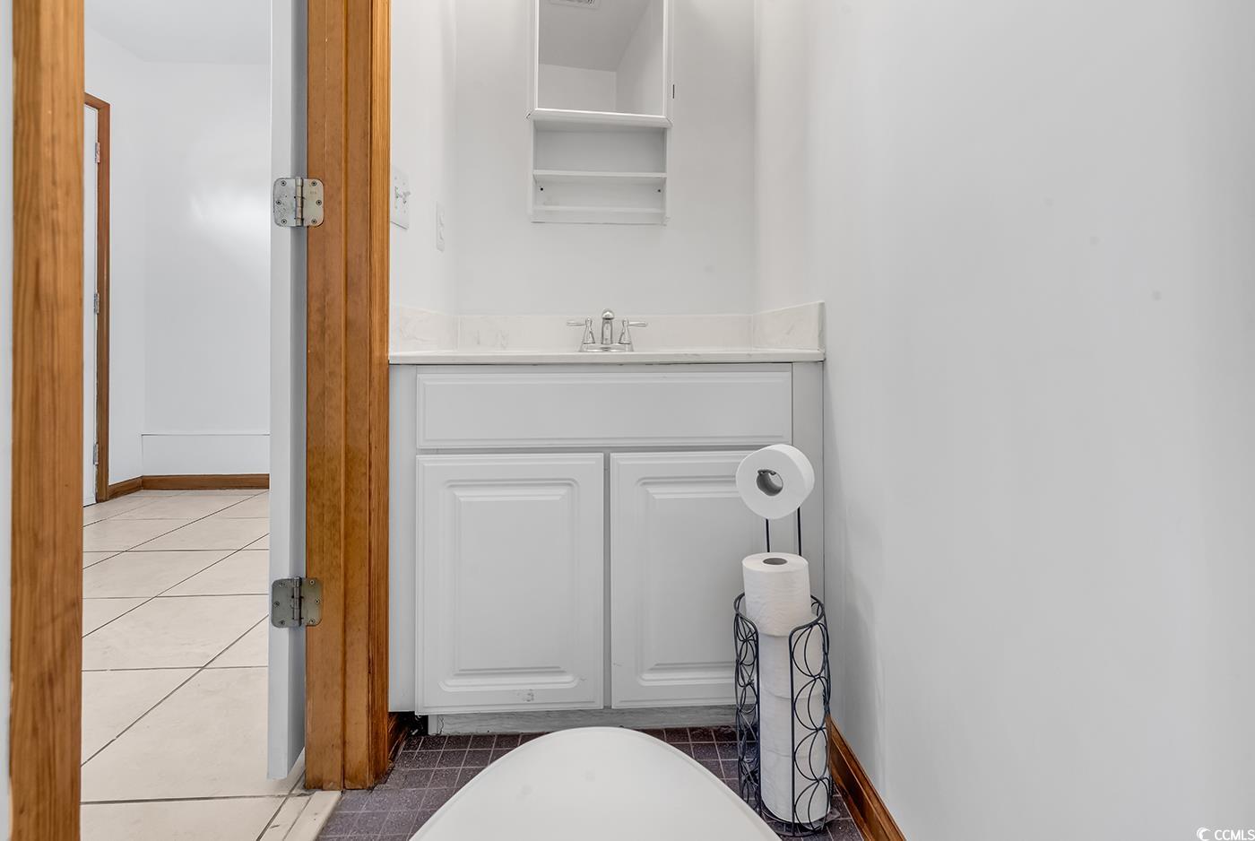 5938 Rahnavard Boulevard Myrtle Beach, SC 29588 - Photo 29 of 39 Bathroom with tile patterned floors and vanity