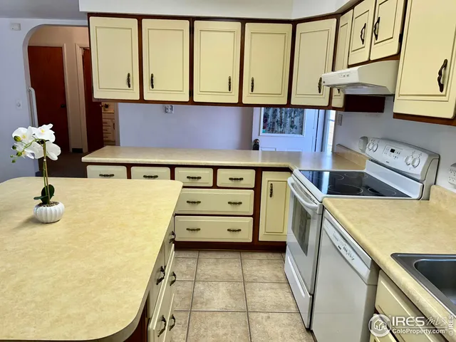 a bathroom with a sink and a washing machine