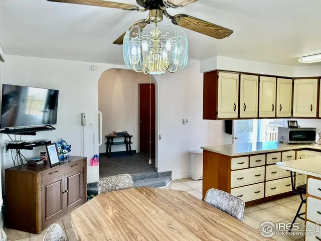 a bedroom with furniture and a flat screen tv