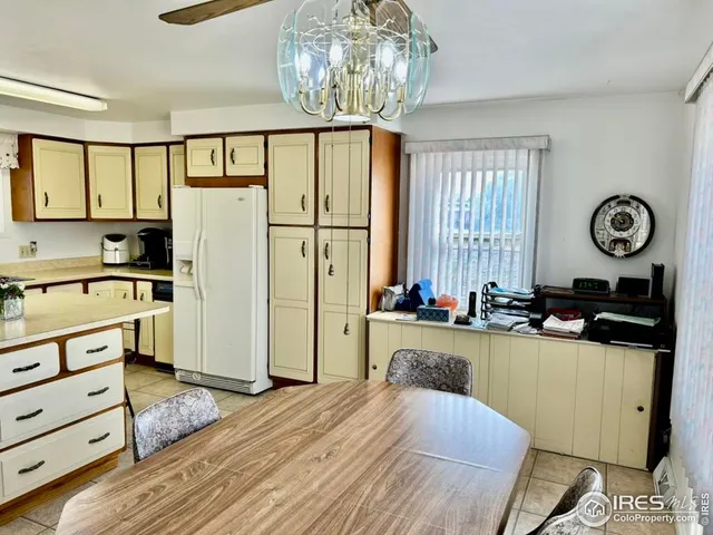 a kitchen with stainless steel appliances granite countertop a refrigerator a stove and a dishwasher with wooden floor