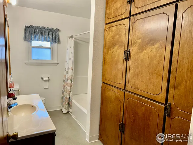 a bathroom with a sink and a shower